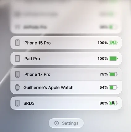 An iPhone, iPad, and Apple Watch with battery information in the AirBuddy Dashboard